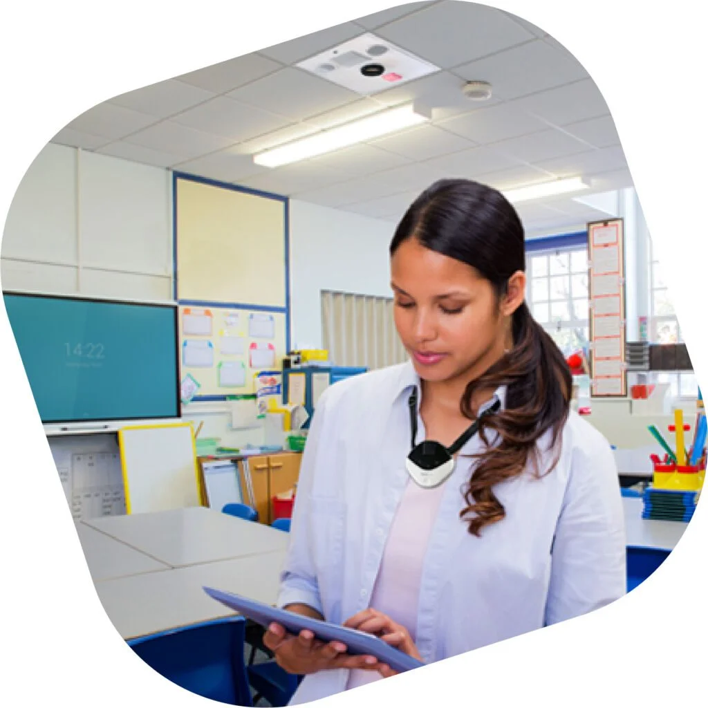 teacher controlling classroom AV and display