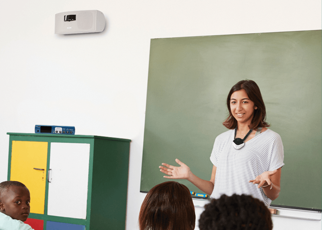 Teacher in Classroom with FrontRow Pro Digital in background