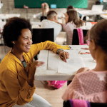 Teacher speaking to student